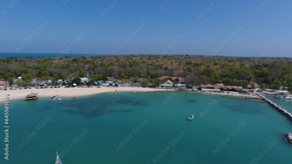 beautiful small populated island surrounded by blue and clean sea water, drone aerial videography, madura, east java, indonesia beautiful small populated island surrounded by blue and clean sea water, drone aerial videography, madura, east java, indonesia