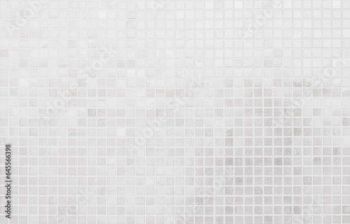 White tile wall chequered background bathroom texture. Ceramic brick wall and floor tiles mosaic background in bathroom.