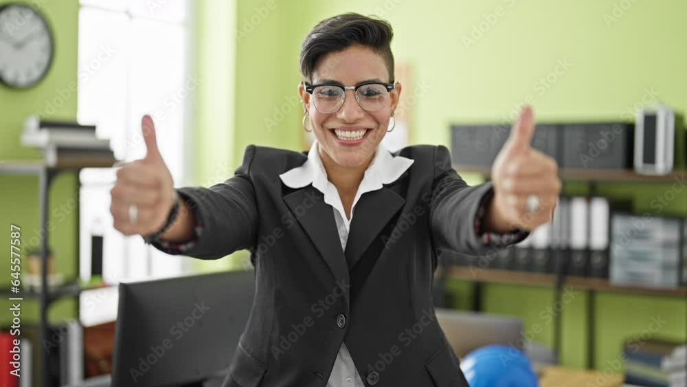 Young beautiful hispanic woman business worker smiling confident doing thumbs up gesture at office Young beautiful hispanic woman business worker smiling confident doing thumbs up gesture at office