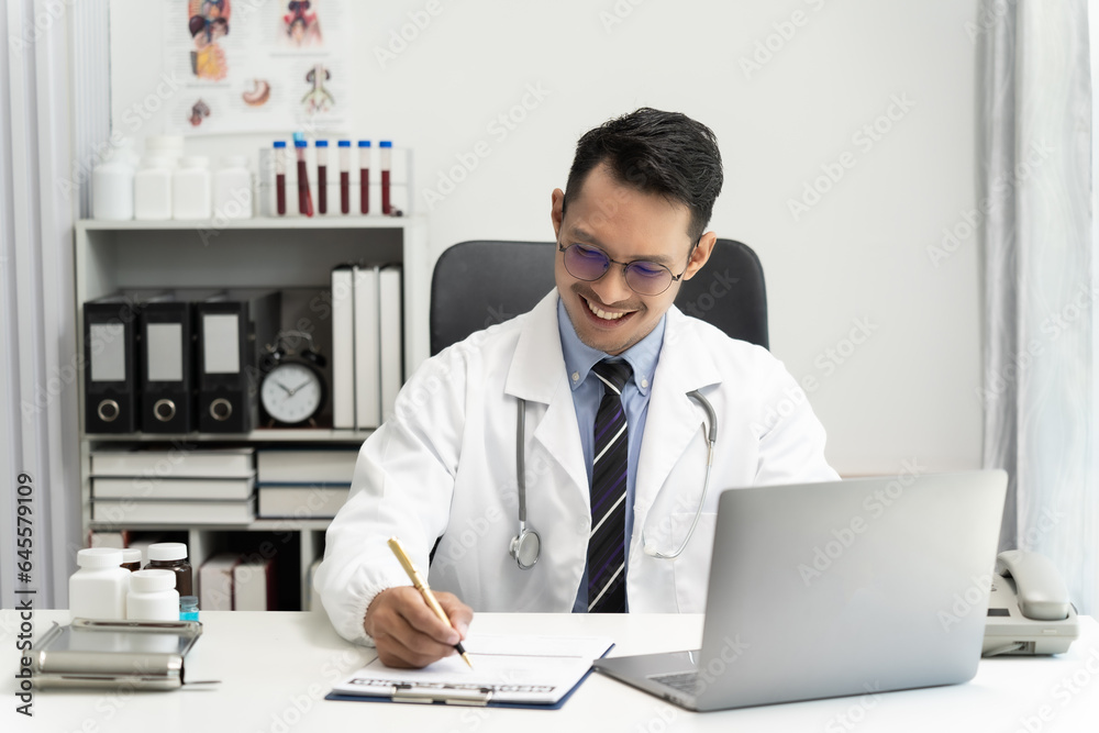 man Asian doctors use computers to explain medical procedures or consult with hospital conference calls. Telemedicine is a healthcare concept.