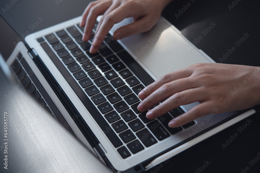 Close up, woman hands typing on laptop computer keyboard, surfing the internet on office table, online, working, business and technology, internet network communication concept Close up, woman hands typing on laptop computer keyboard, surfing the internet on office table, online, working, business and technology, internet network communication concept