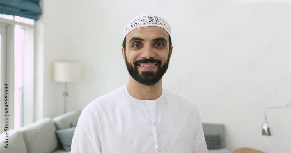 Head shot portrait wellbeing mature 45s Arabic man in traditional white ...