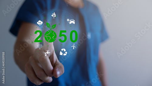 Hand holding virtual Global with CO2 reducing icon for concept of decrease carbon dioxide emission ,carbon footprint and carbon credit to limit global warming from climate change concept.