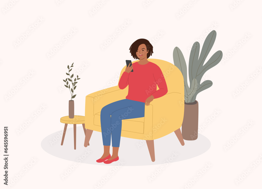 One Smiling Young Black Woman Sitting On Sofa While Using Her Mobile Phone. Full Length. One Smiling Young Black Woman Sitting On Sofa While Using Her Mobile Phone. Full Length.