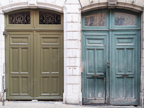 restored wooden door facade before and after painting and repair by professional garage gate entrances portal © OceanProd