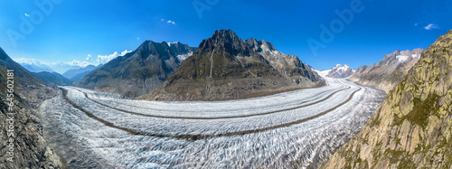 Aerial panorama view of the Aletsch Glacier with Olmenhorn, Geisshorn and Trugberg peaks at the background. A UNESCO World Heritage in Valais, Switzerland photo