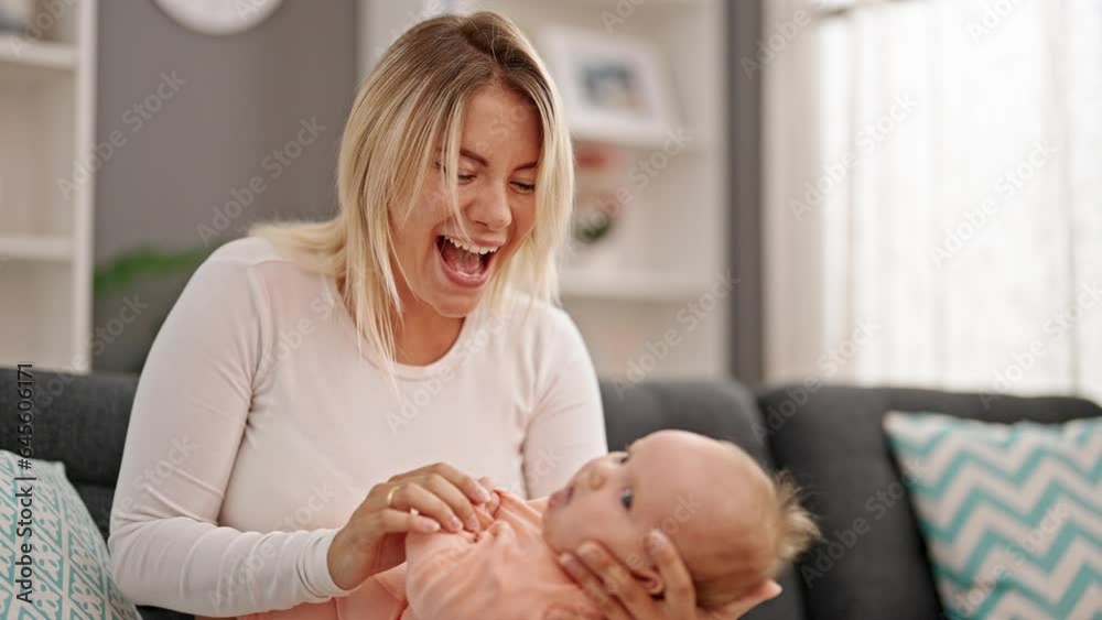 Mother and daughter hugging each other at home Mother and daughter hugging each other at home
