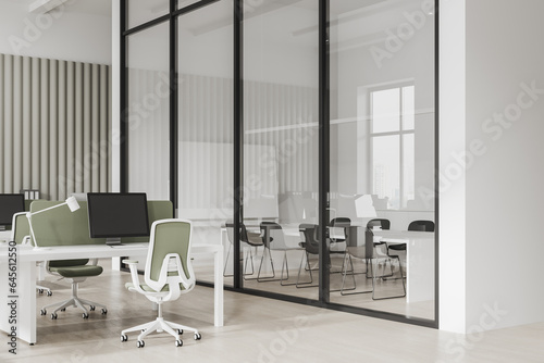 Stylish office interior with meeting and coworking room  pc monitors in row