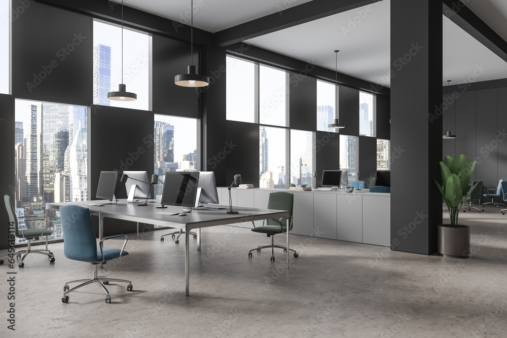 Modern coworking interior with pc monitors and sideboard with panoramic window Modern coworking interior with pc monitors and sideboard with panoramic window