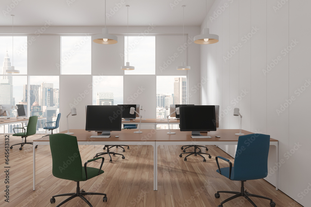 White office interior with pc monitors and desk near panoramic window White office interior with pc monitors and desk near panoramic window