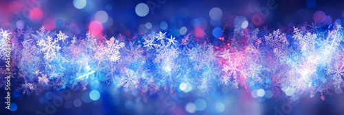 Defocused Christmas background with snowflakes and lights. panoramic banner 