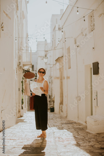 Female tourist with paper c...