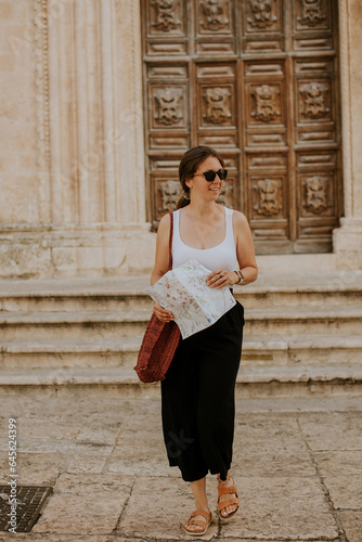 Female tourist with city ma...