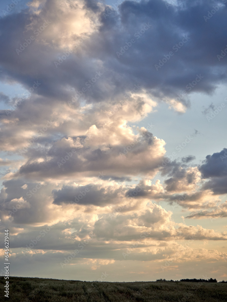 Beautiful white clouds at sunset. Large space and aerial perspective.