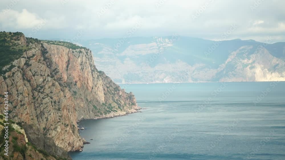 Aerial view on calm azure sea and volcanic rocky shores. Small waves on water surface. Nature summer ocean sea beach view. Nobody. Holiday, vacation and travel concept. Weather and climate change Aerial view on calm azure sea and volcanic rocky shores. Small waves on water surface. Nature summer ocean sea beach view. Nobody. Holiday, vacation and travel concept. Weather and climate change
