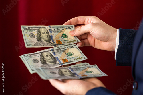 businessman hand holding money