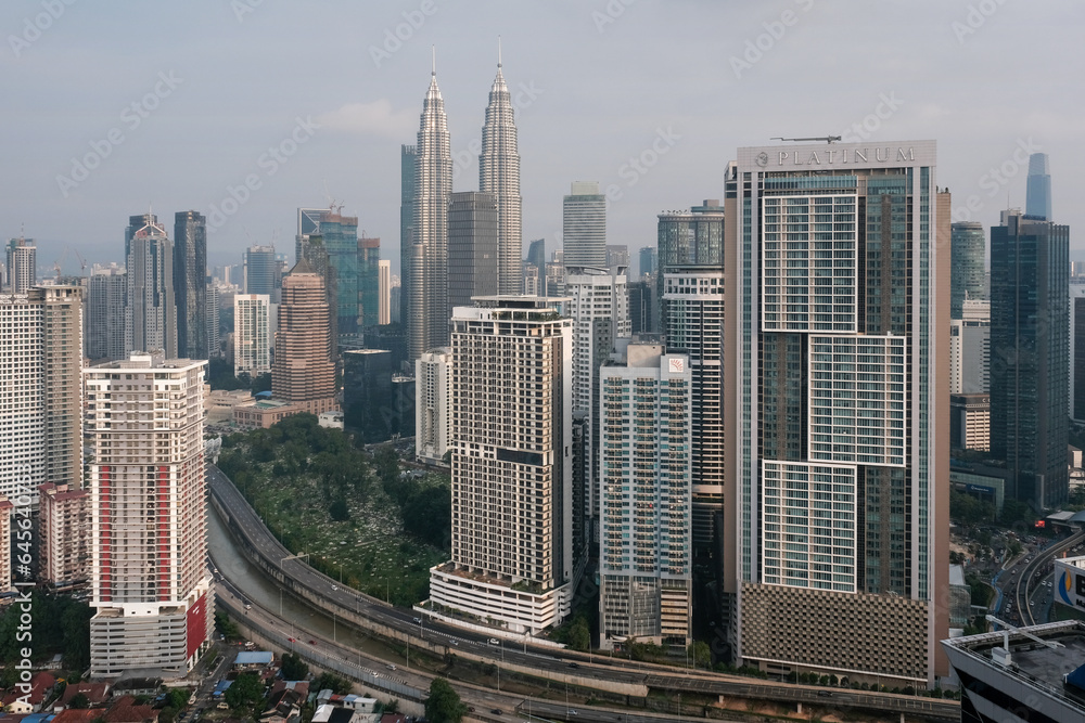 View of Kuala Lumpur and Petronas Twin Towers on sunny day. Malaysia.