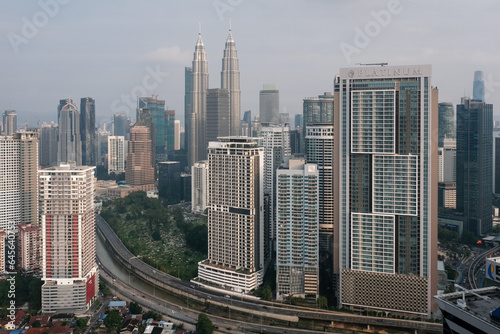 View of Kuala Lumpur and Petronas Twin Towers on sunny day. Malaysia.