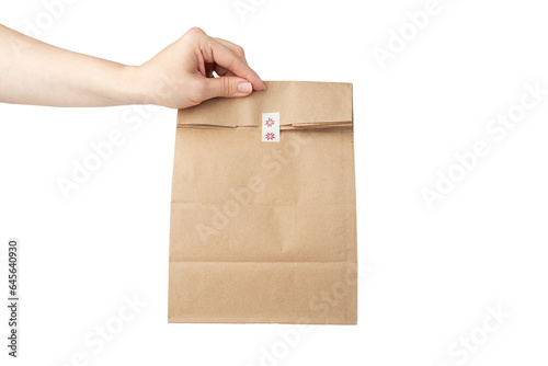 take away bag in hand isolated, grocery delivery, responsible lunch packaging