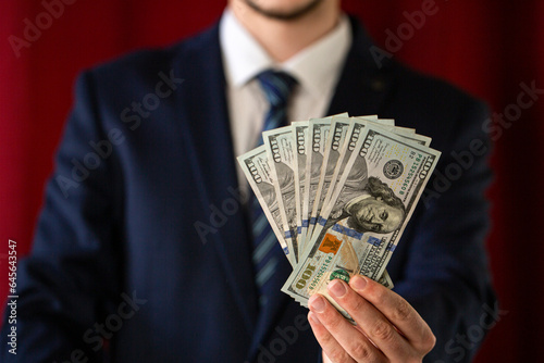 businessman holding money , dollars 5