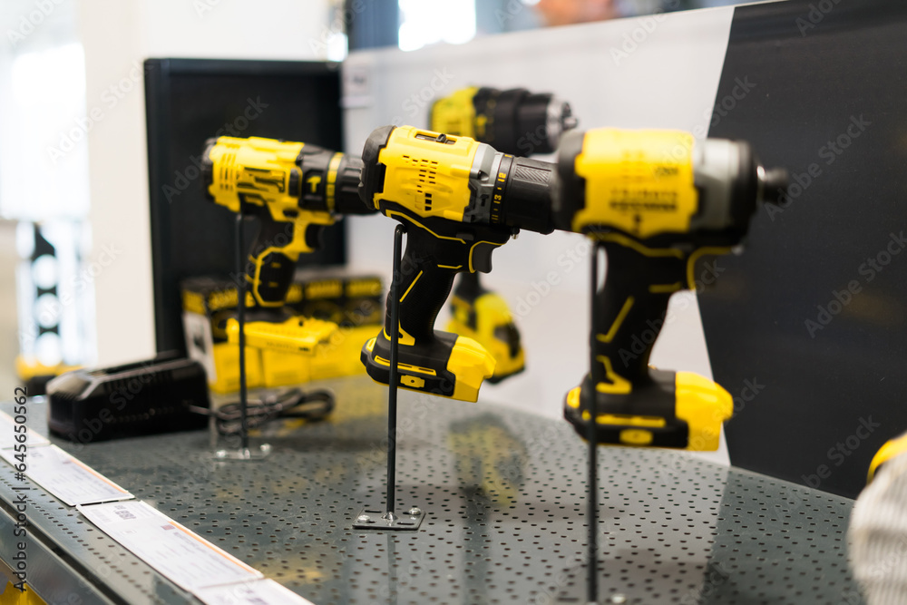 Tool for work, repair and construction in store. Wired power tools and battery powered equipment Tool for work, repair and construction in store. Wired power tools and battery powered equipment