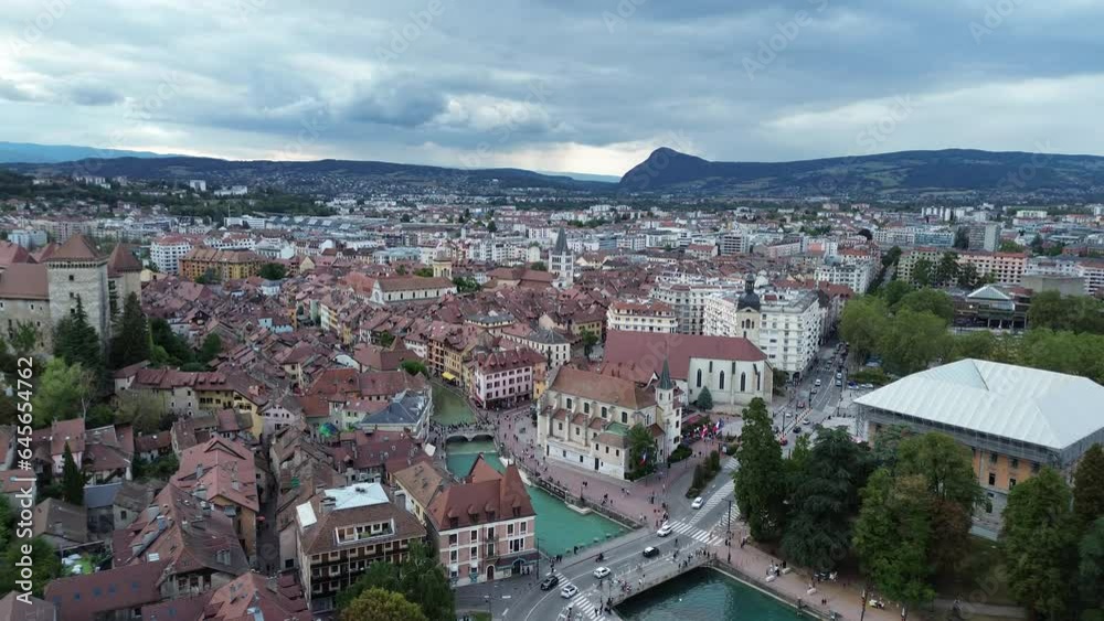 Annecy city center panoramic aerial view over the old town, castle, Thiou river and mountains surrounding the lake. Annecy is known as the Venice of the French Alps Annecy city center panoramic aerial view over the old town, castle, Thiou river and mountains surrounding the lake. Annecy is known as the Venice of the French Alps