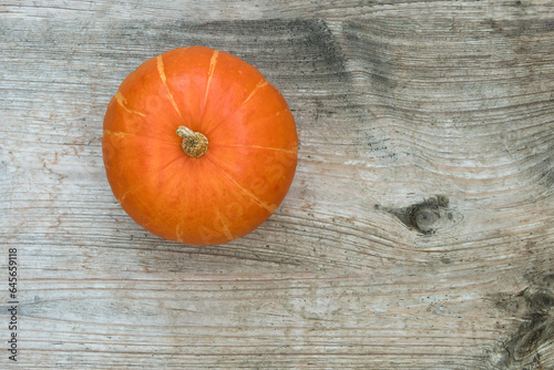 Top view of pumpkin on wooden old unpainted table
