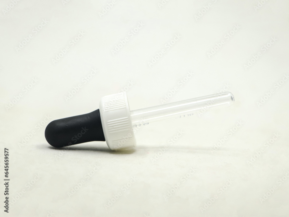 closeup shot of a plastic eye dropper pipette tool used for medical and scientific purposes isolated in a white background closeup shot of a plastic eye dropper pipette tool used for medical and scientific purposes isolated in a white background