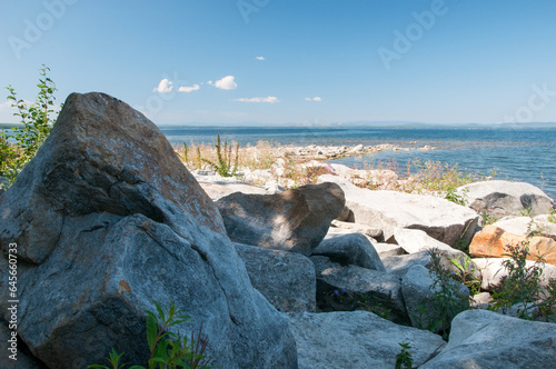 Landscape summer view of Uvildy lake with boulders in the foreground, South Ural, Russia photo