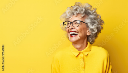 Portrait of a smiling woman on a yellow background for Black Friday