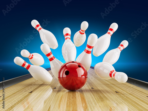 Red Bowling Ball Hit the Bowling pins on bowling alley line. Bowling strike  competition or tournament concept