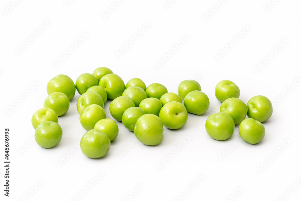 Green plums isolated on white background. Fruit concept. Green plums isolated on white background. Fruit concept.