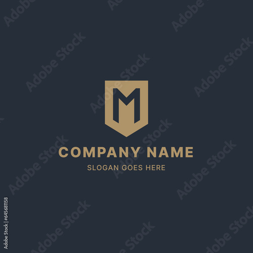 Letter M and Shield gold logo design