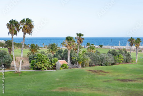 extensive 18 holes golf courses spreading between the tranquil resort with the same name and a small harbor known as Marina San Miguel at Amarilla Golf, Tenerife, Canary Islands, Spain