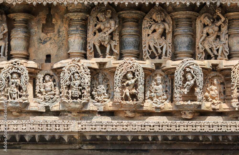 A Charming Sculpture carvings of Hindu Goddesses and Dancers on the exterior walls of 'Chennakeshava'stone temple in Karnataka, India.