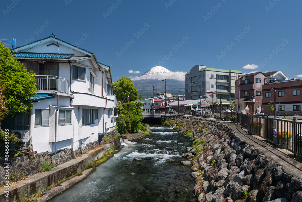Fujinomiya town by Kanda river with mt. Fuji at Shizuoka Fujinomiya town by Kanda river with mt. Fuji at Shizuoka
