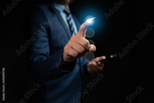 Businessman with hologram check list, technology assisted list checking for accuracy, AI use for list check work. Checklist concept using technology.