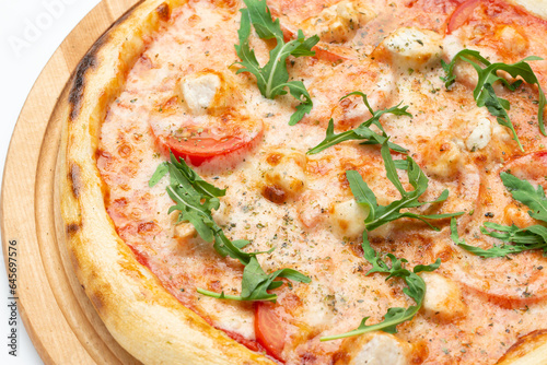 Fresh Italian pizza with arugula and cheese, close-up. Isolated on white background.