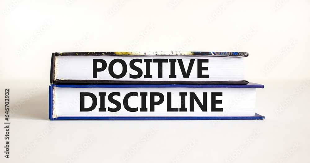 Positive discipline symbol. Concept words Positive discipline on beautiful books. Beautiful white table white background. Business psychology positive discipline concept. Copy space.