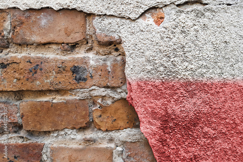 Flag of Poland. The concept of a European state, democracy, elections. Polish banner on the background of a brick wall in the style of street art with copy space. Independence Day.