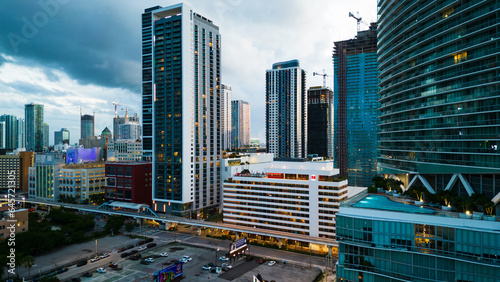 Aerial drone  of Downtown Miami skyline office buildings and apartments at sunset illuminated with light