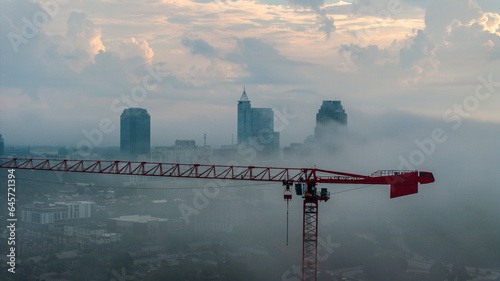 Foggy Morning in Raleigh with Construction Crane and Skyline - Aerial View