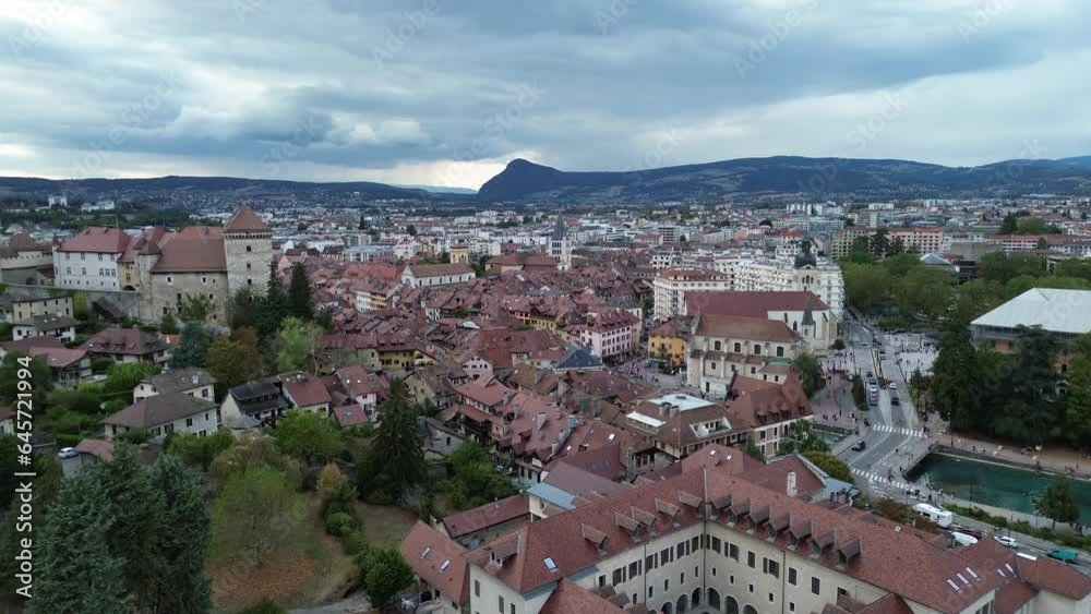 Annecy city center panoramic aerial view over the old town, castle, Thiou river and mountains surrounding the lake. Annecy is known as the Venice of the French Alps Annecy city center panoramic aerial view over the old town, castle, Thiou river and mountains surrounding the lake. Annecy is known as the Venice of the French Alps
