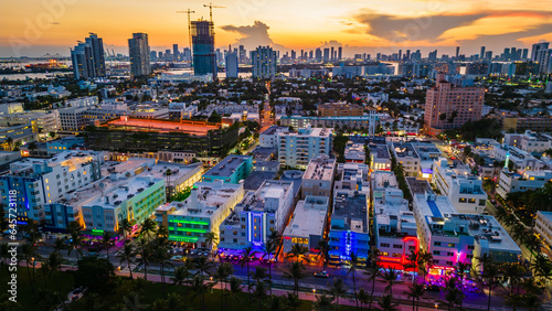 Aerial of Miami South Beach illuminated at night at sunset ocean road iconic landmark  © Michele