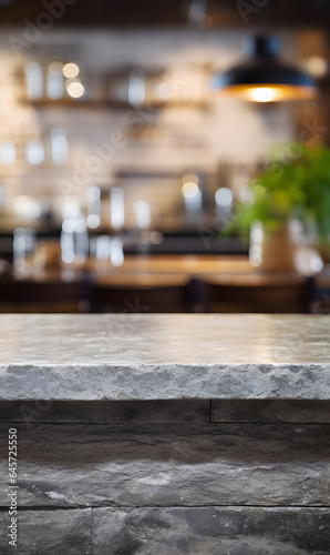 Gray textured stone bar counter and blurred restaurant on a background.