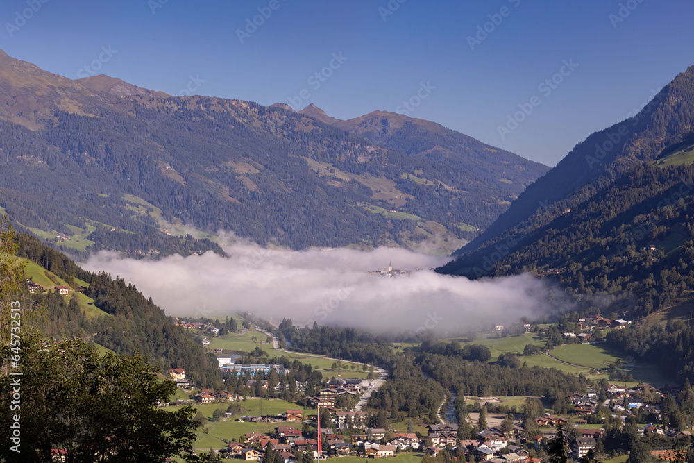 Austrian mountain valley under the morning fog
