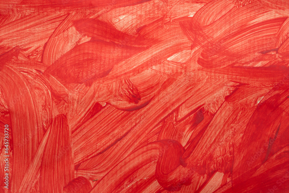 Red paint splatter and brush strokes on paper texture Red paint splatter and brush strokes on paper texture