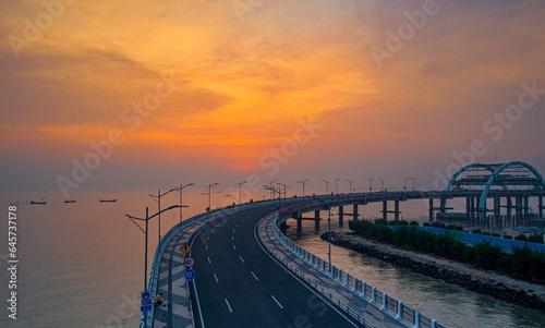 afternoon on the road bridge over the sea photo