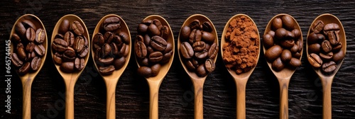 Wooden spoons with coffee beans - different sort ground and whole. Top view on wooden background.