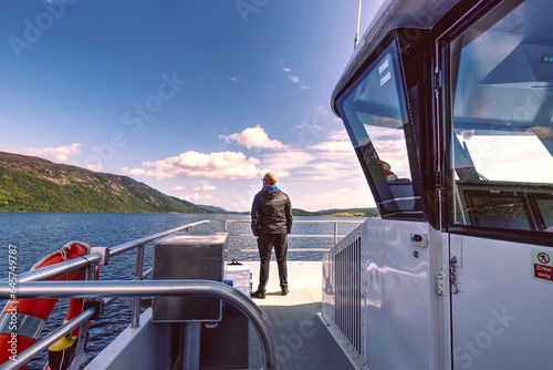 Passenger Ship with Tourists Approaching Urquhart Castle on Loch Ness